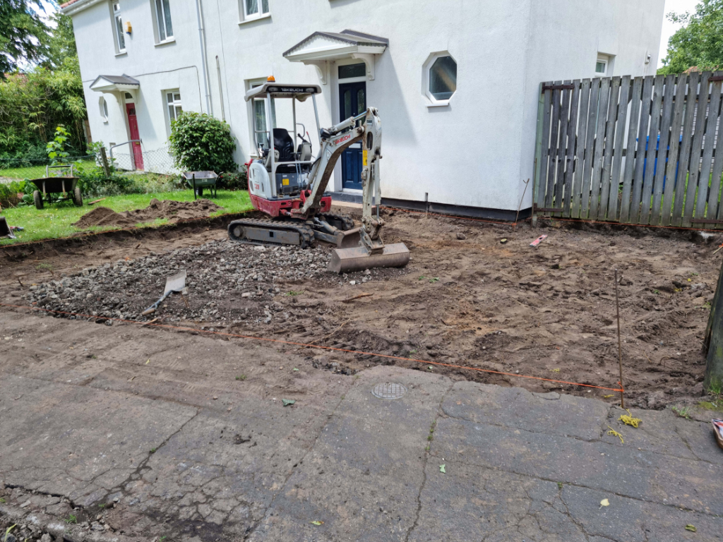 This is a photo of a dig out being carried out by This is a photo of newly installed chip and tar drive by Linton Driveway Installations in preparation for a block paving driveway